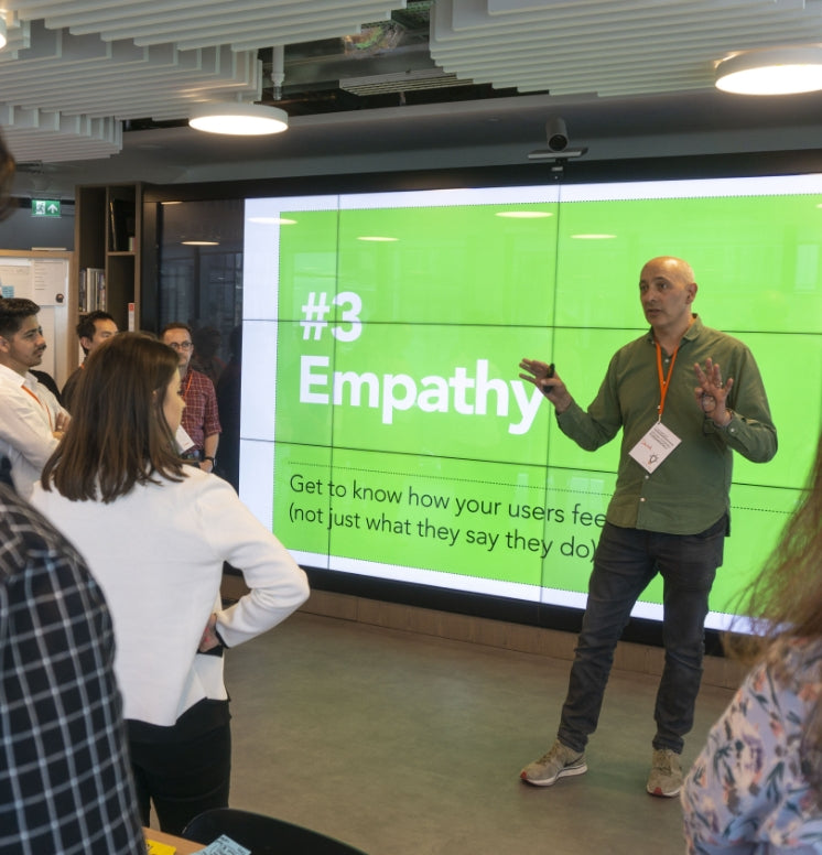 David Kester teaching a group about the importance of empathy in user research