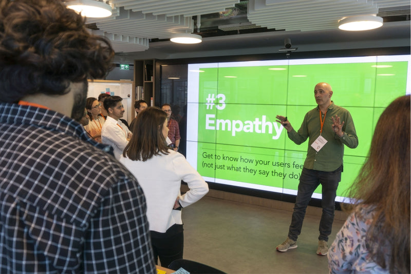 David Kester teaching a group of people about the importance of empathy in user research